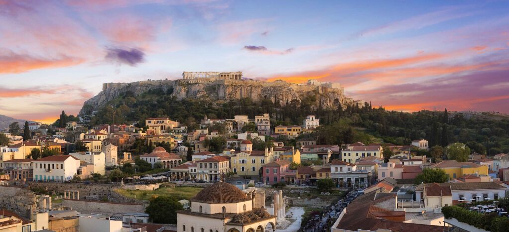 Acropolis of Athens at sunset and the old city in the foreground