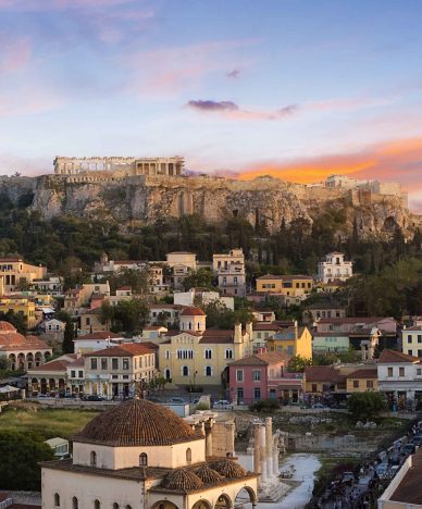 Acropolis of Athens at sunset and the old city in the foreground